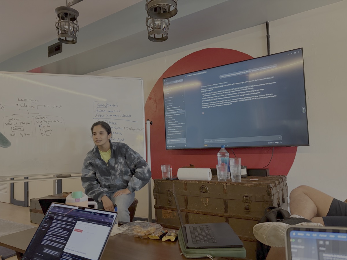 Nadeen leading a session recap beside the live Claude screen